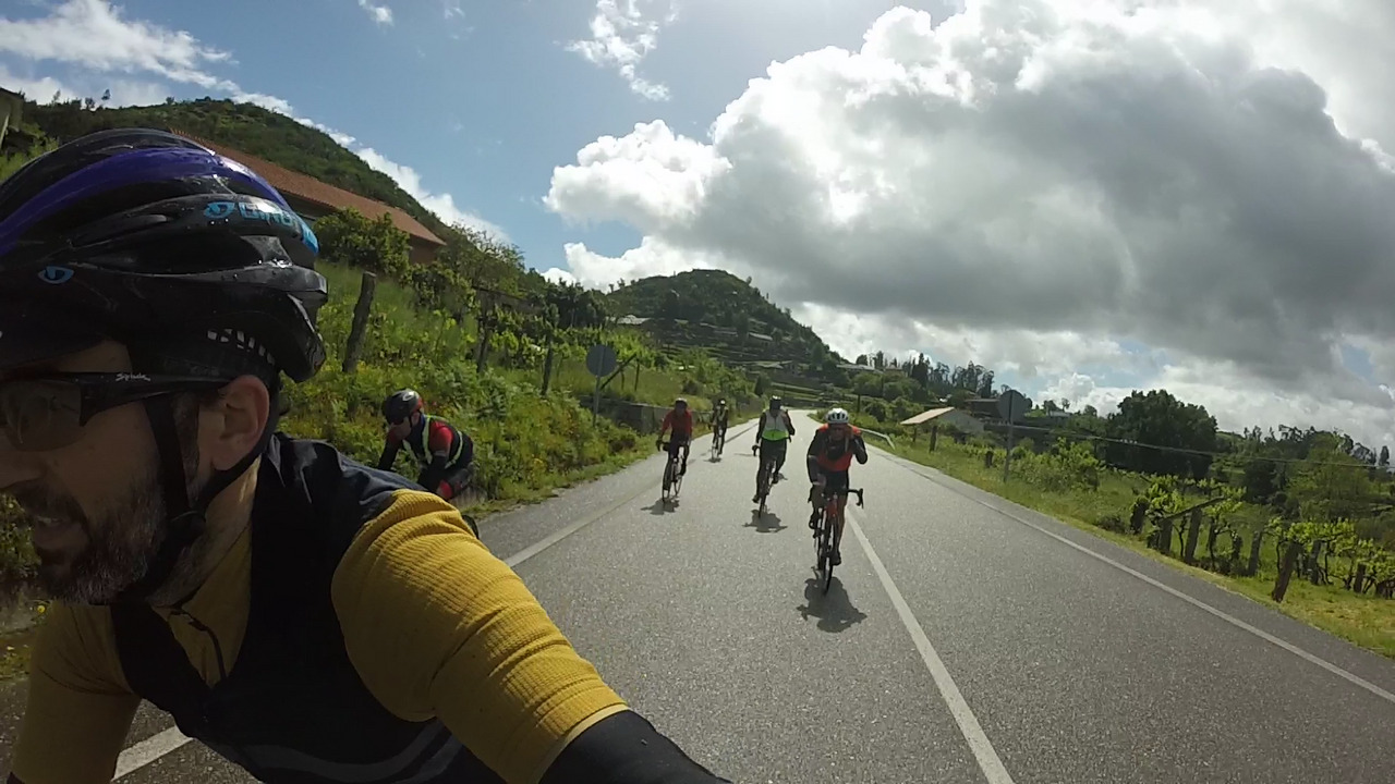 The whole group riding downhill, behind me, with the sun warming us up