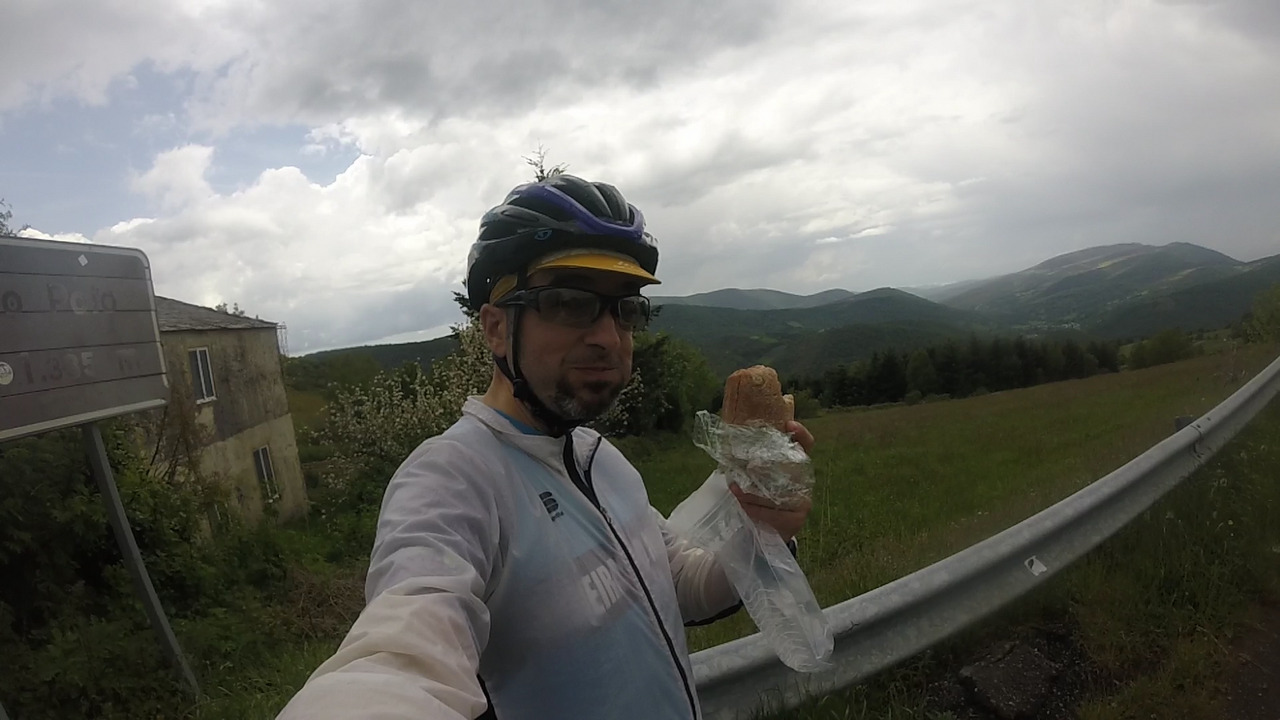 Myself, in the center of the picture with the bocadillo de jamon in one hand, and the nice views behind