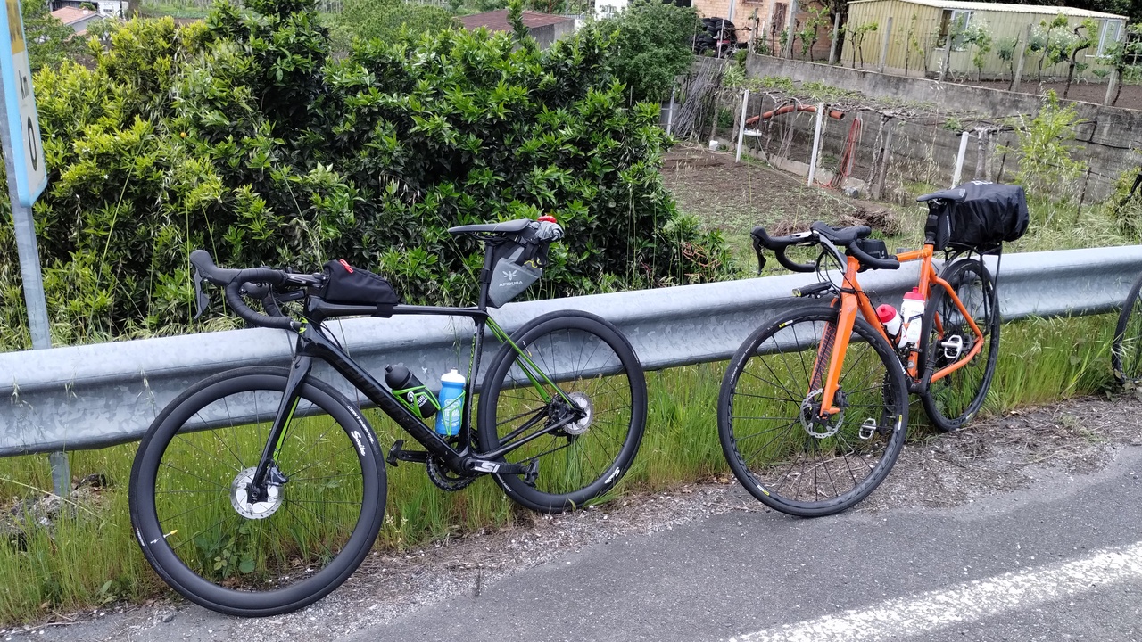 My bike, leaning on a road protection barrier, along Graeme's