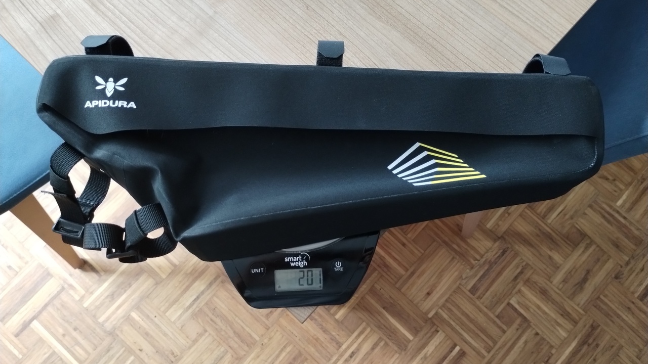 The racing frame pack, on a scale to measure its weight. The scale shows 201 grams