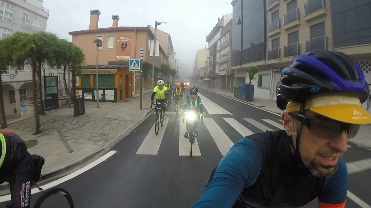 Our little group riding through the main street/road in Arzúa at 7:15 in the morning