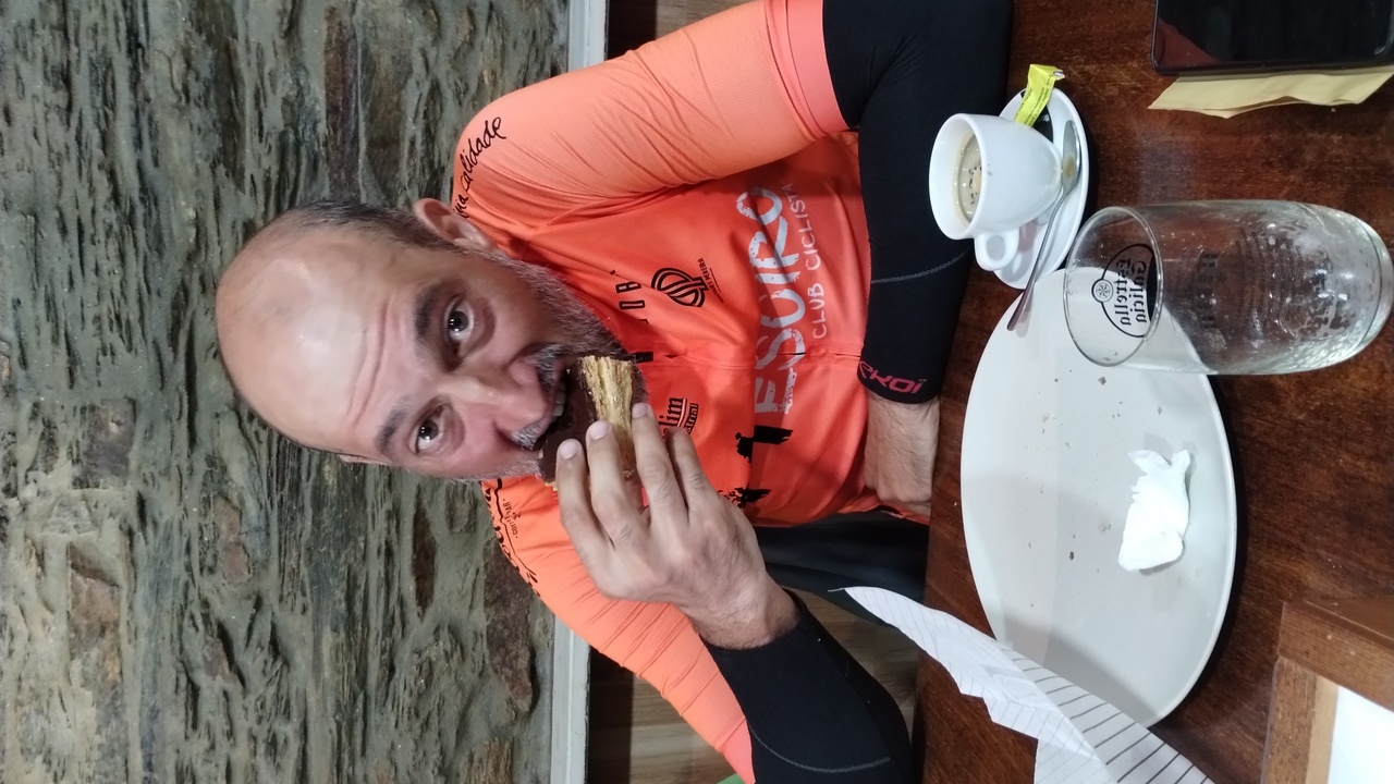 Dani, eating one of the pastries he bought in a bakery nearby for all of us
