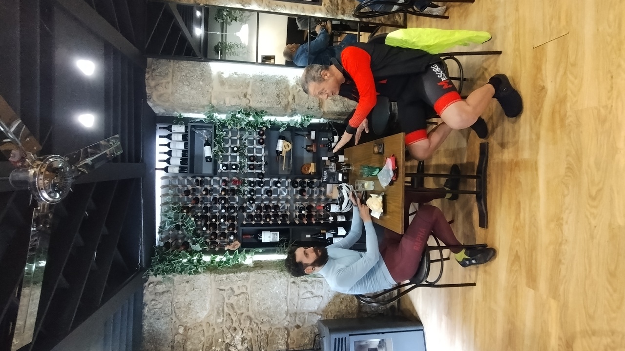 Alex and Oscar, sitting at a table in Chantada, discussing a few things from the Brevet so far