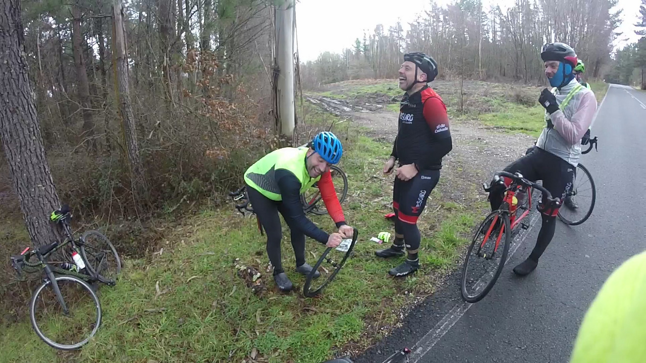 The same two cyclists laughing at some jokes we made while they worked on that inner tube