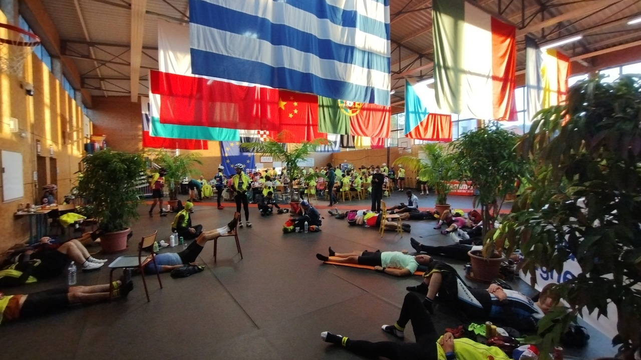 One last view of the building to get our stamps in Fougerès, with people laying on the floor, some sleeping, some simply getting some rest