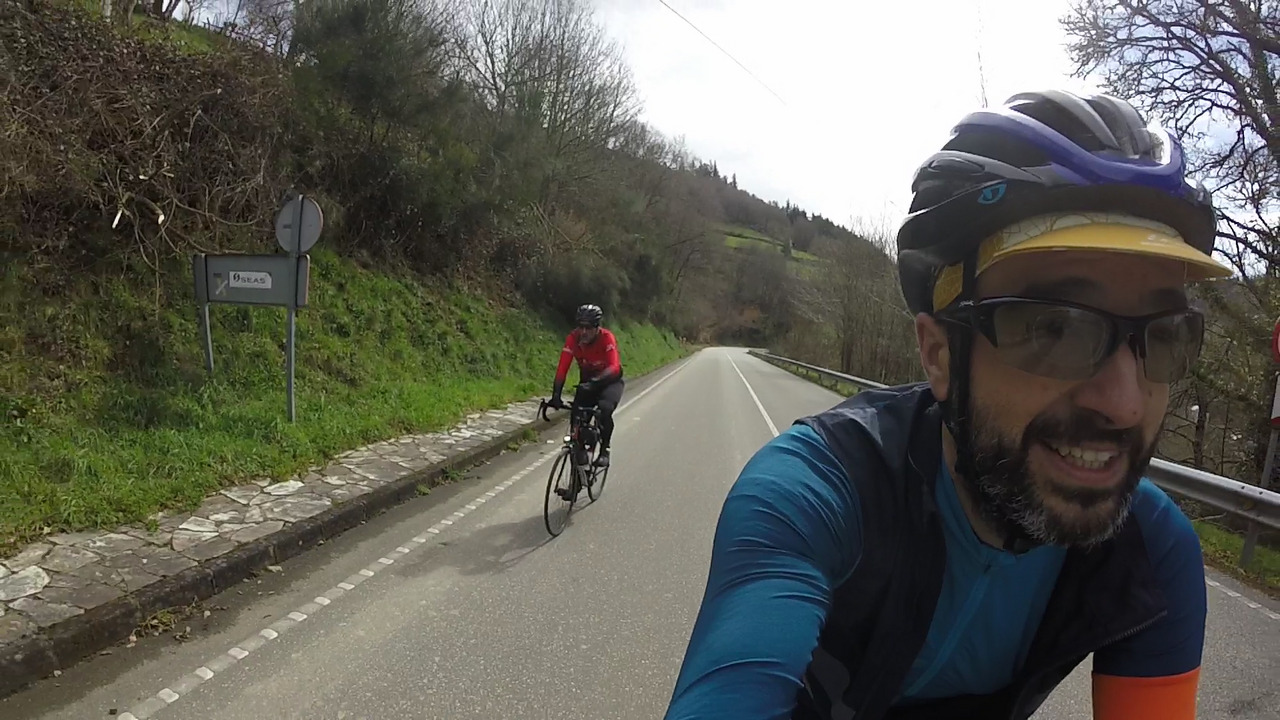 Me and Dani, smiling while passing the sign that marks the entrance of Santa Eulalia