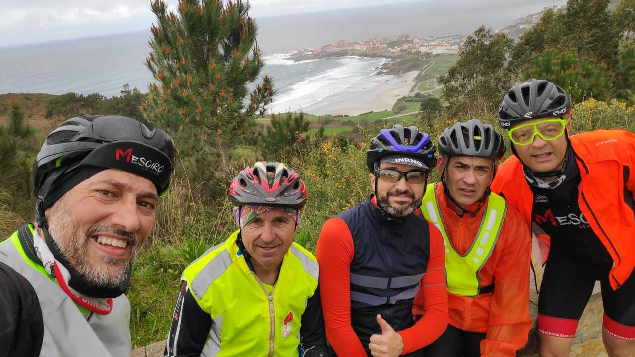 (in order) Dani, Cesar, me, Jose and Oscar with the Atlantic ocean behind us and the little village of caion.