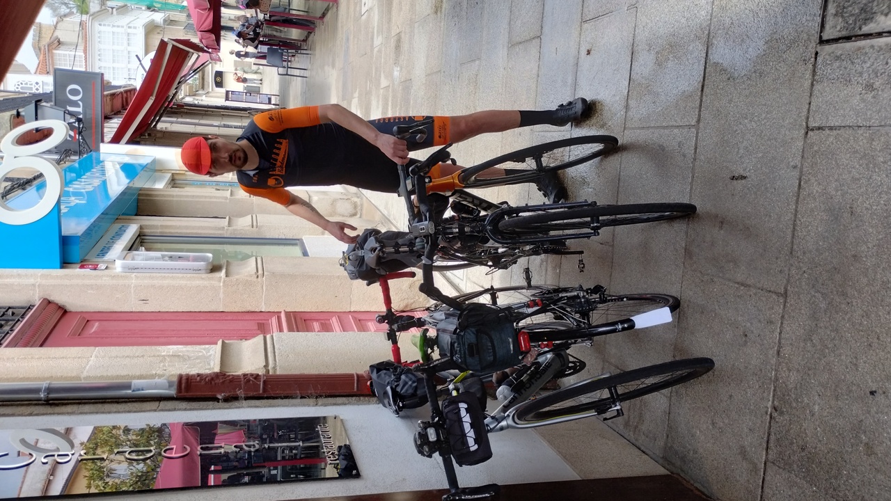 Sergio, picking up his bike from the parking place with several other bikes