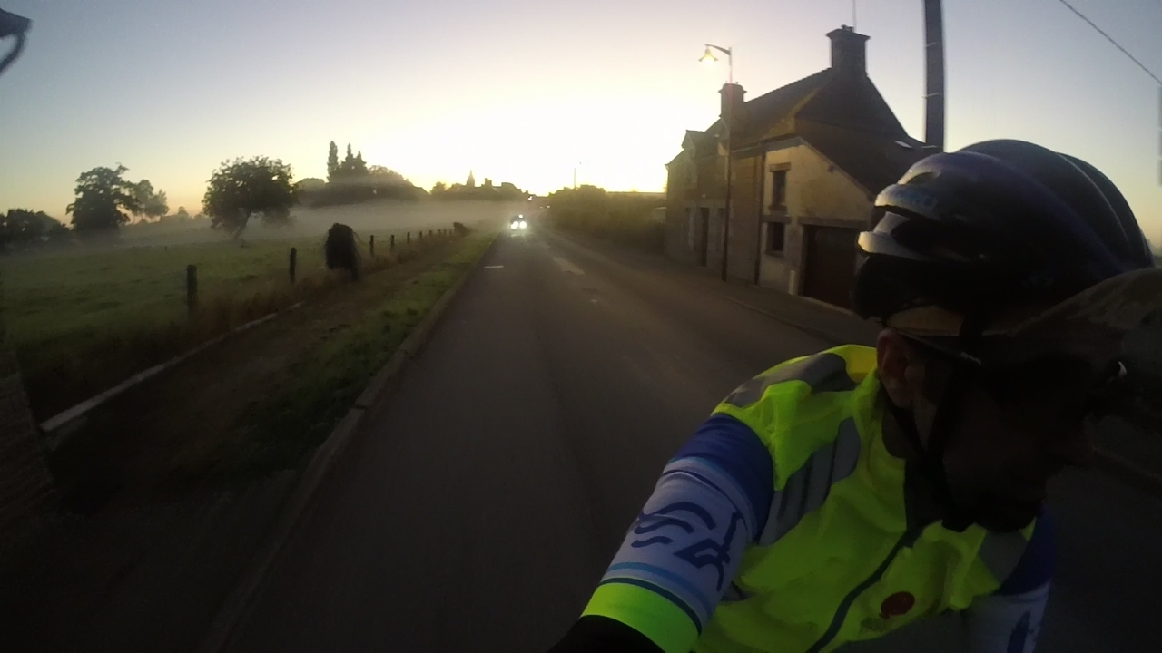 A few head lights coming on my direction. It was early morning, first rays of light and a thin mist was floating near the ground