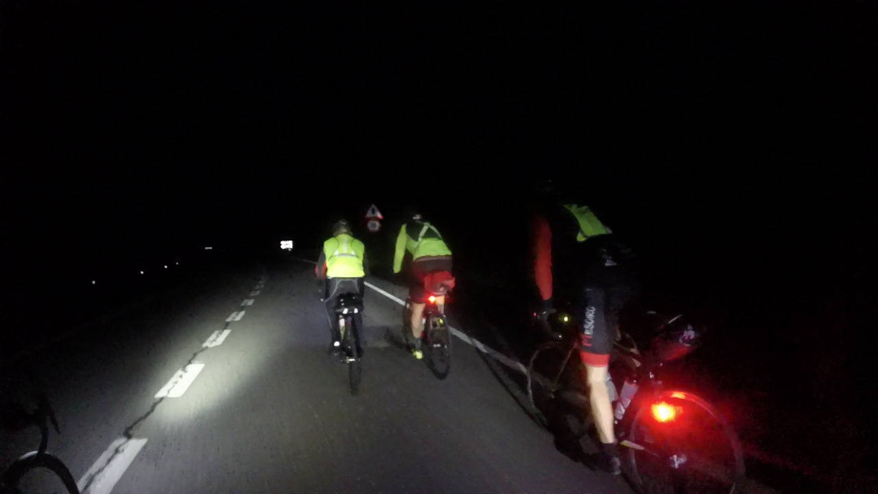 Jose, Dani and Oscar, riding up to alto de dozón in the middle of a very dark night.