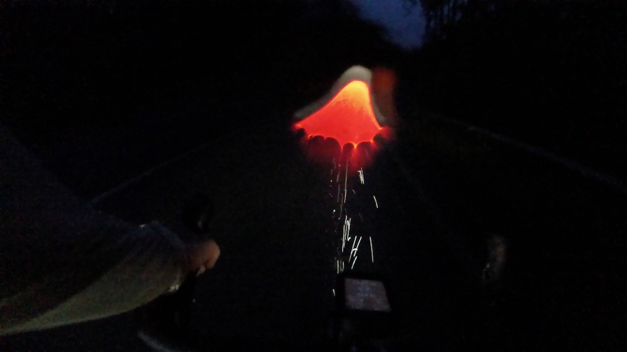 Blurry image of the chase through the night rain on the small road from Burela to San Cibrao. It was raining so much, plus the spray from the road, that soon my glasses were covered with too much water again, making the tail lights in front of me to make interesting shapes and colors