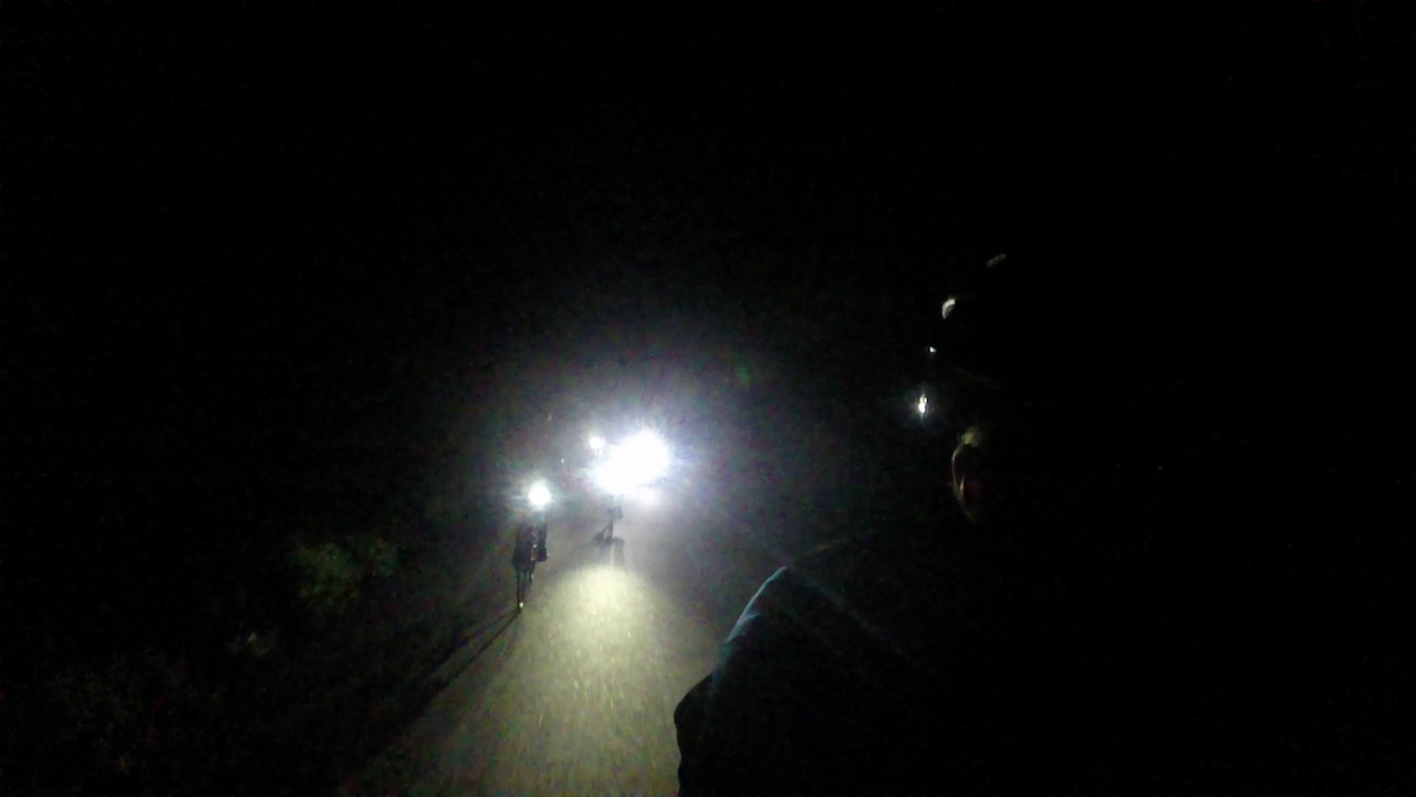 Me, riding in the dark, being chased by a group of front lights