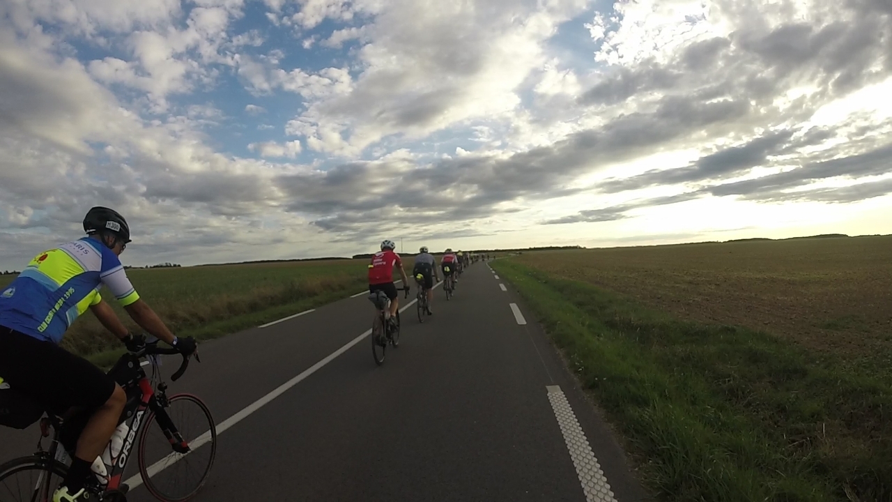Dani riding a bit ahead of me, we both being part of a long line of cyclists roding towards sunset