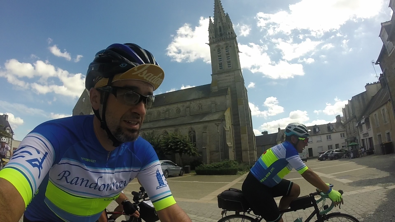 Ferreiro and me, riding with some others through the village of Plèmet