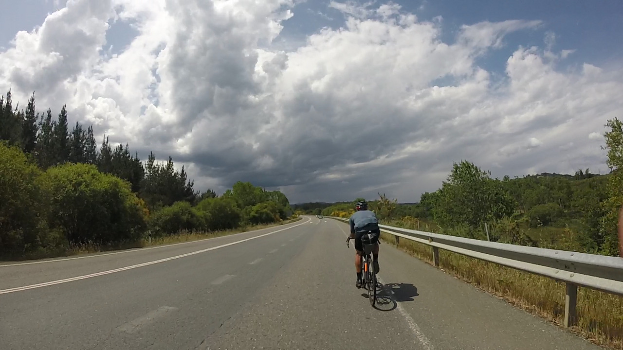 Sergio Pulido, riding ahead of us, towards Monforte, towards some big clouds that were forming over town
