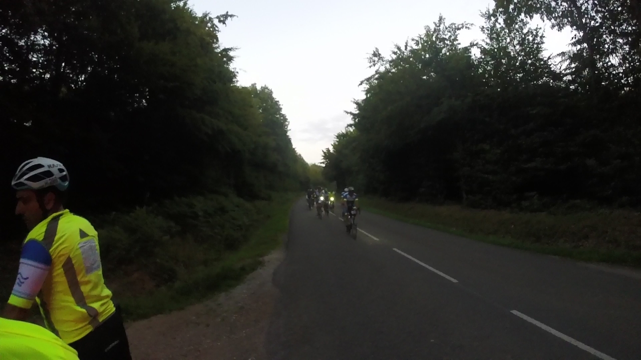 Ferreiro, on the left, after zipping his vest. A faster group approaching us on the right