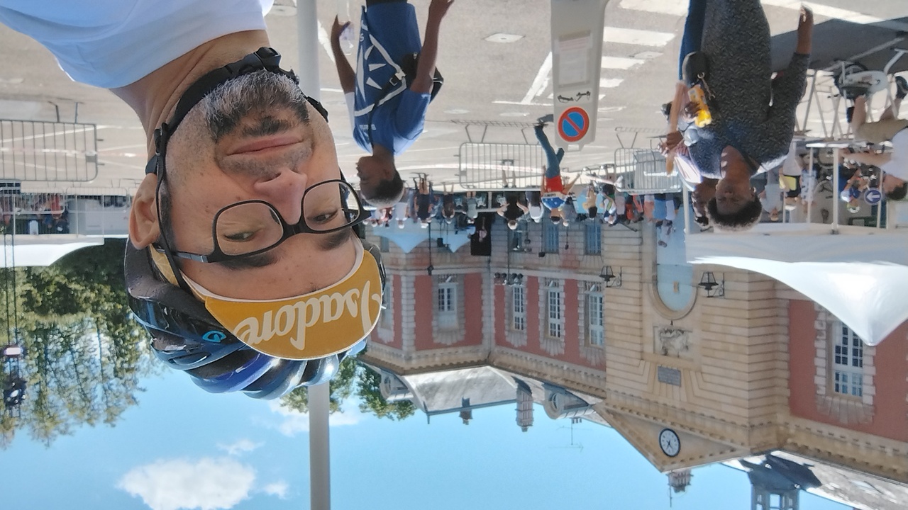 Selfie by the square in front of the city council building in Rambouillet. I am wearing my isadore cycling cap and giro helmet, as we were riding across the village to the to the place for lunch