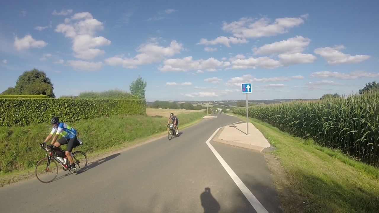 Stopped on the top of another hill, I took some pictures of the others, like this one with Dani leading and one of Santy's friends following him