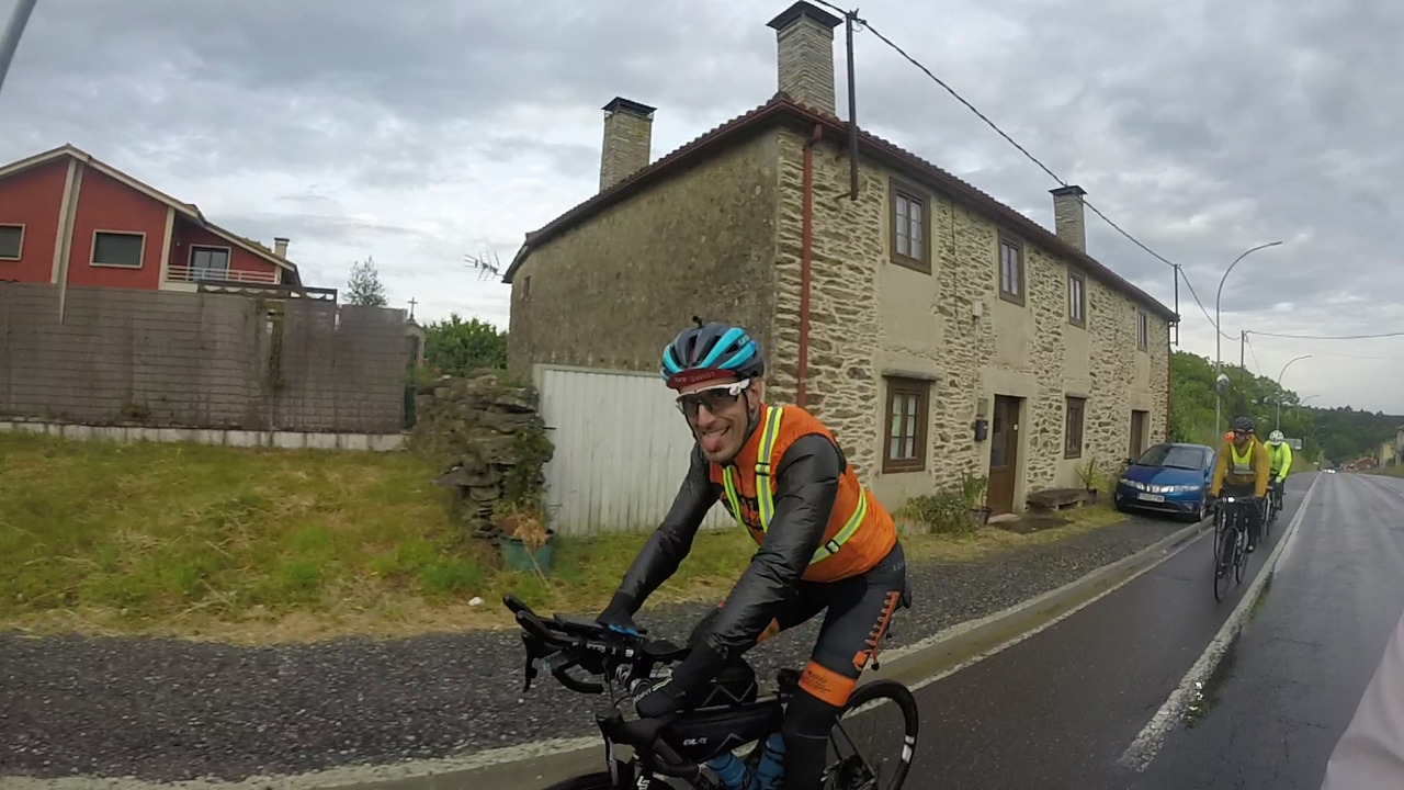 Roberto, super happy and all wet, on the road from Lalin to Santiago