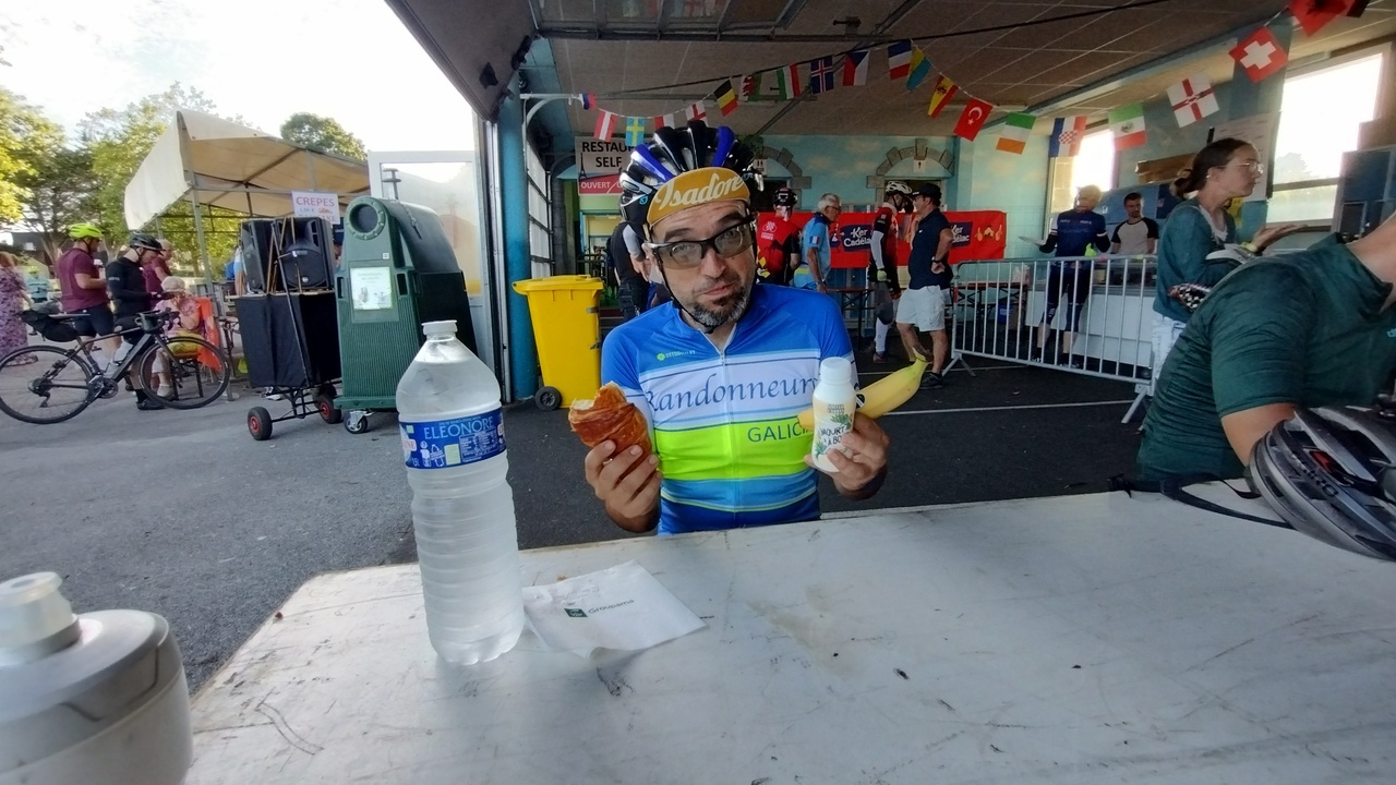 Me, with the food I ordered. My face is saying 'not hungry, but a randonneur has to eat!'