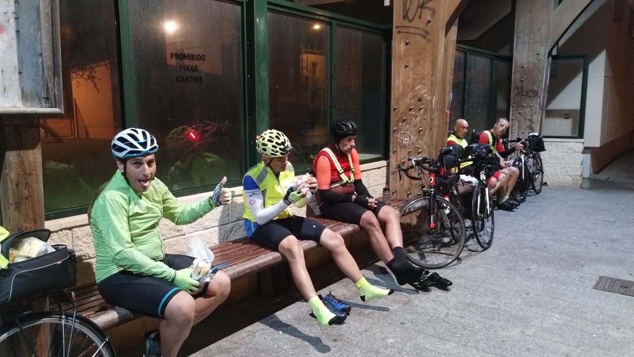 From left to right, Ferreiro, Manolo, Dani, Jose and Oscar, sitting on the big benches on the bus stop in San Cibrao