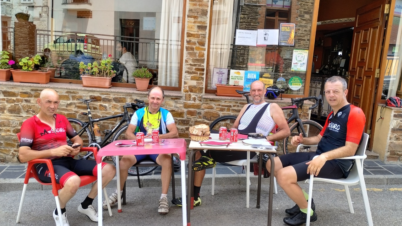 Jose, Cesar, Dani and Oscar, sitting at the tables in Casa Diego's terrace in Santa Eulalia, waiting for our lunch