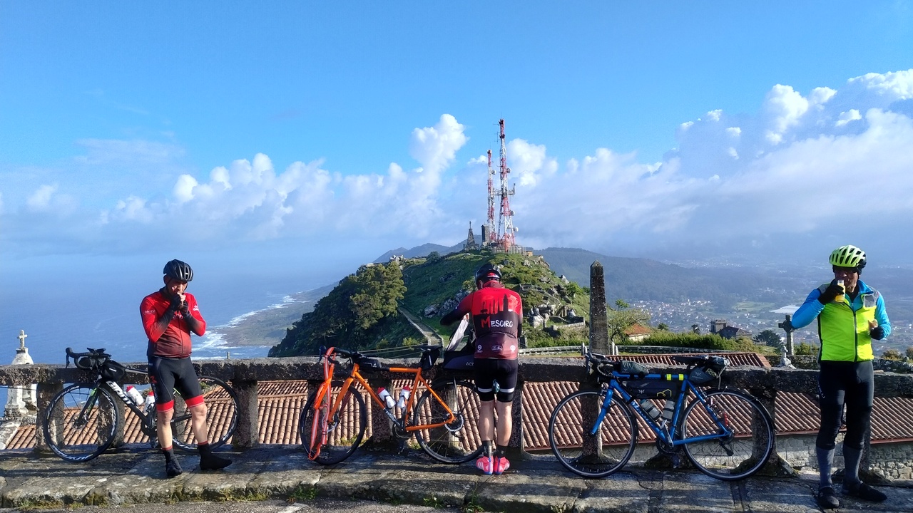 Jose, Edgar and Ferreira, at the top of Santa Trega, eating something and relaxing a bit after the hard climb