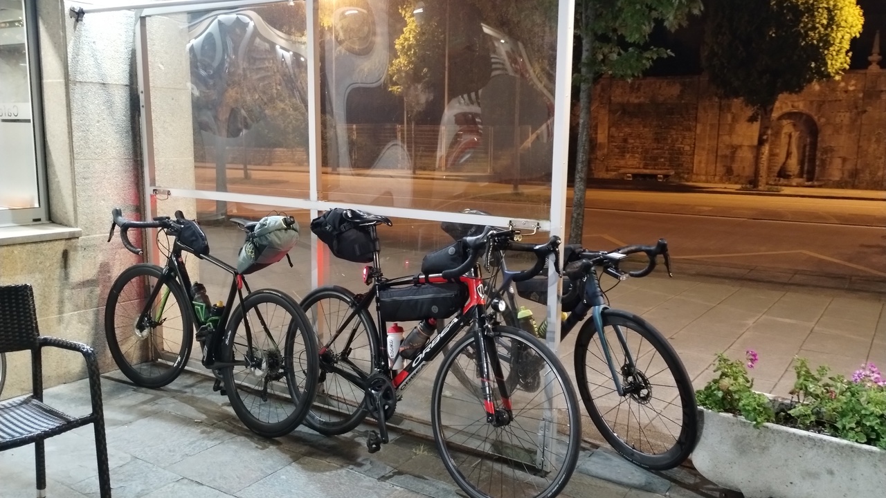My cannondale synapse, Dani's Orbea and Alex's Giant TCR Advanced, leaning on a plastic/glass wall during our coffee stop in Santiago