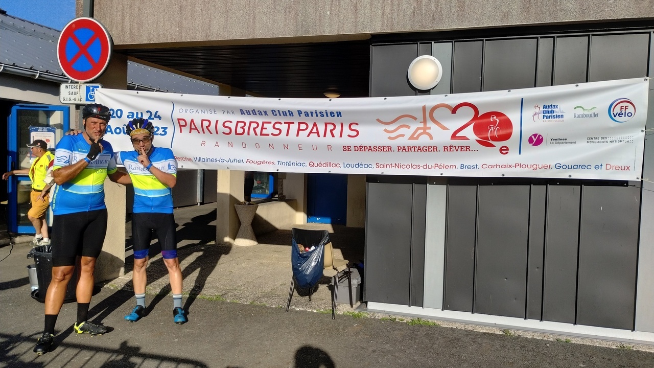 Dani and me, with our index finger on our lips on a 'shhhhh' gesture, in front of the big banner the ACP had set up in the control building