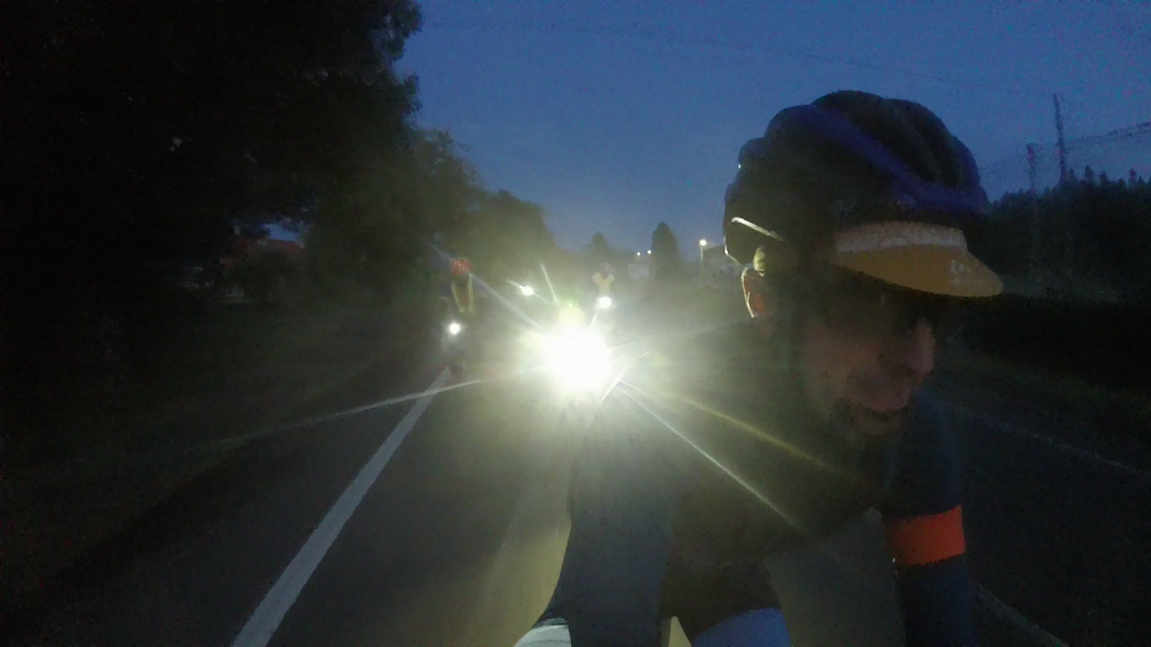 The bright front lights of the rest of the group, chasing me, roberto and estefania on our way to Arzua