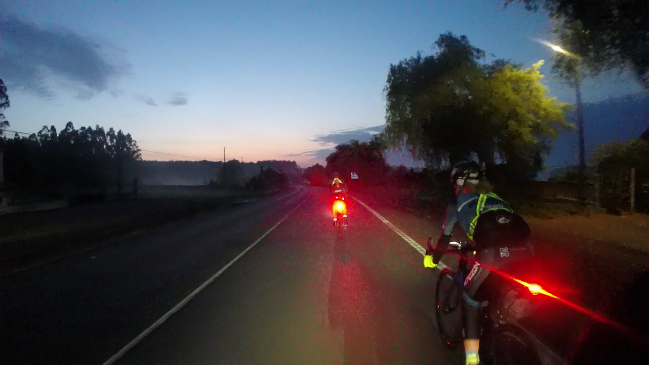 The red tail lights of roberto and estefania, on the road to Arzua