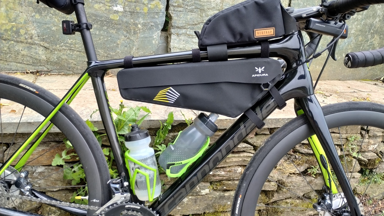 Close up picture of the synapse, loaded for a test, racing frame pack, top tube bag, and two bottles in their bottle cages