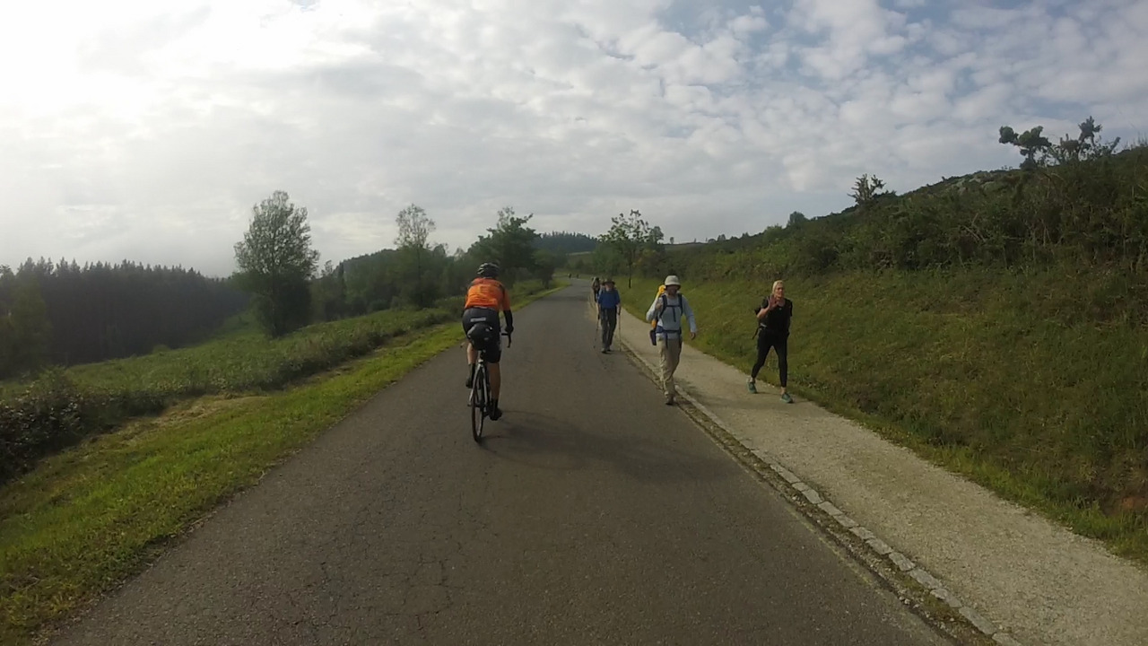Roberto, passing by a few pilgrims doing El Camino de Santiago