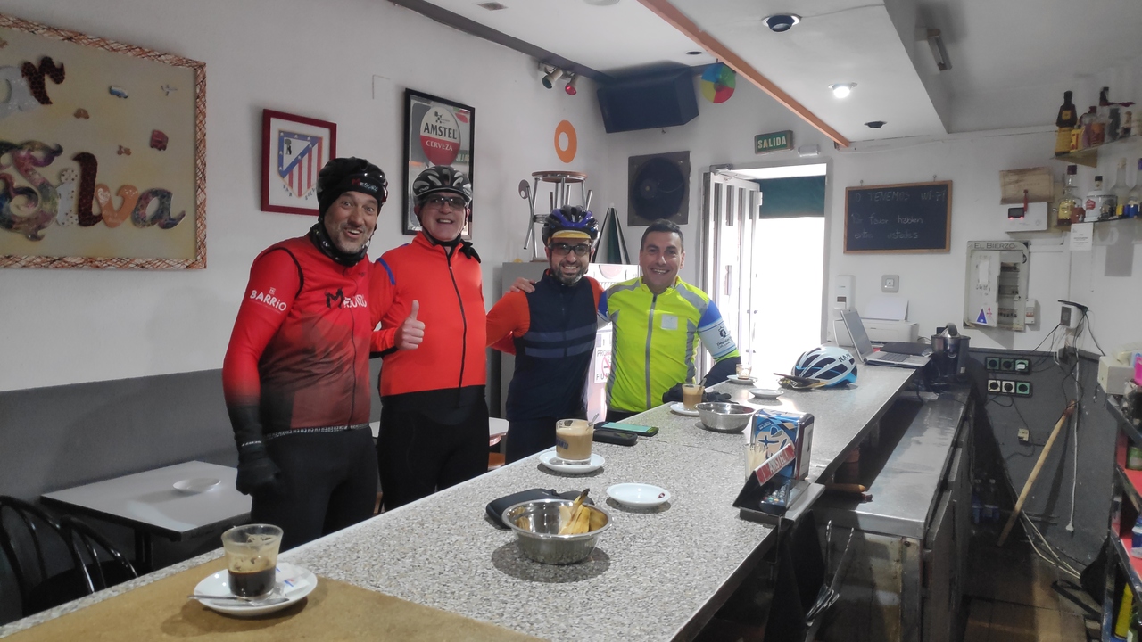 Dani, Juankar, me and Ferreiro during our coffee stop in Toreno, inside the bar, coffee and tea is served on the bar in front of us