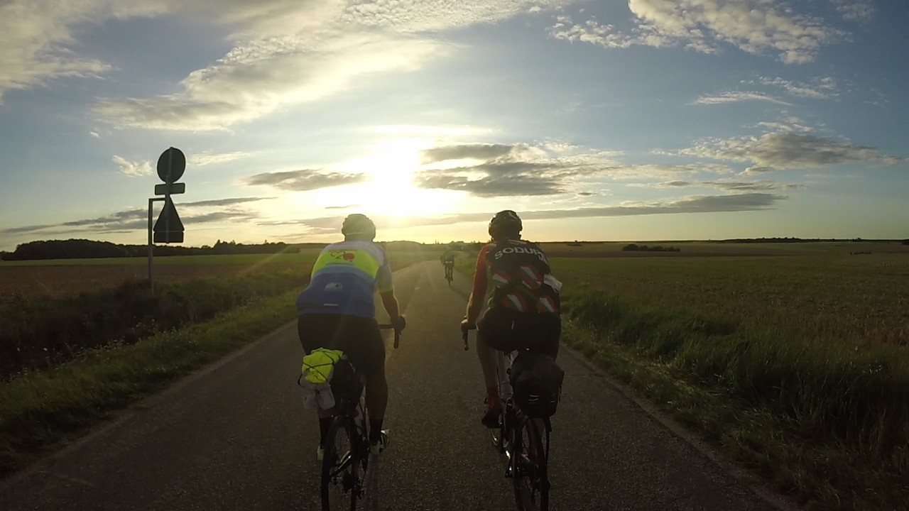 Dani and Juankar, riding side by side towards sunset