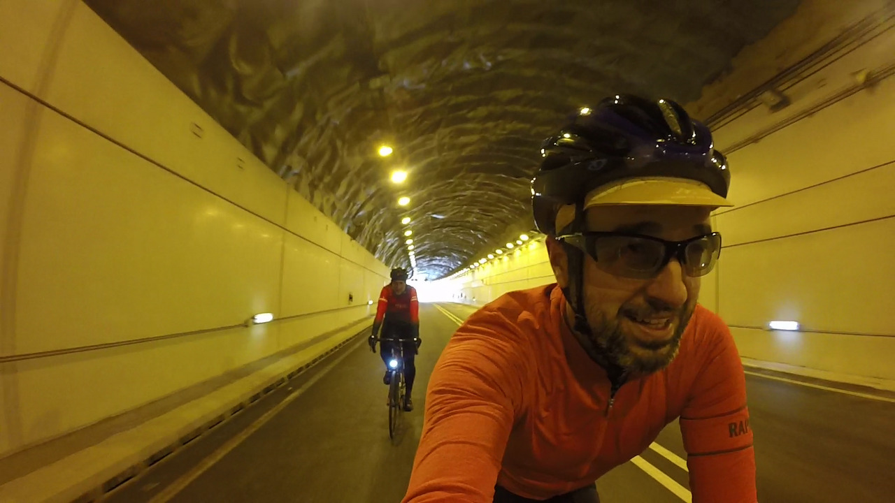 Close up photo of me, with dani riding behind, through the tunnel